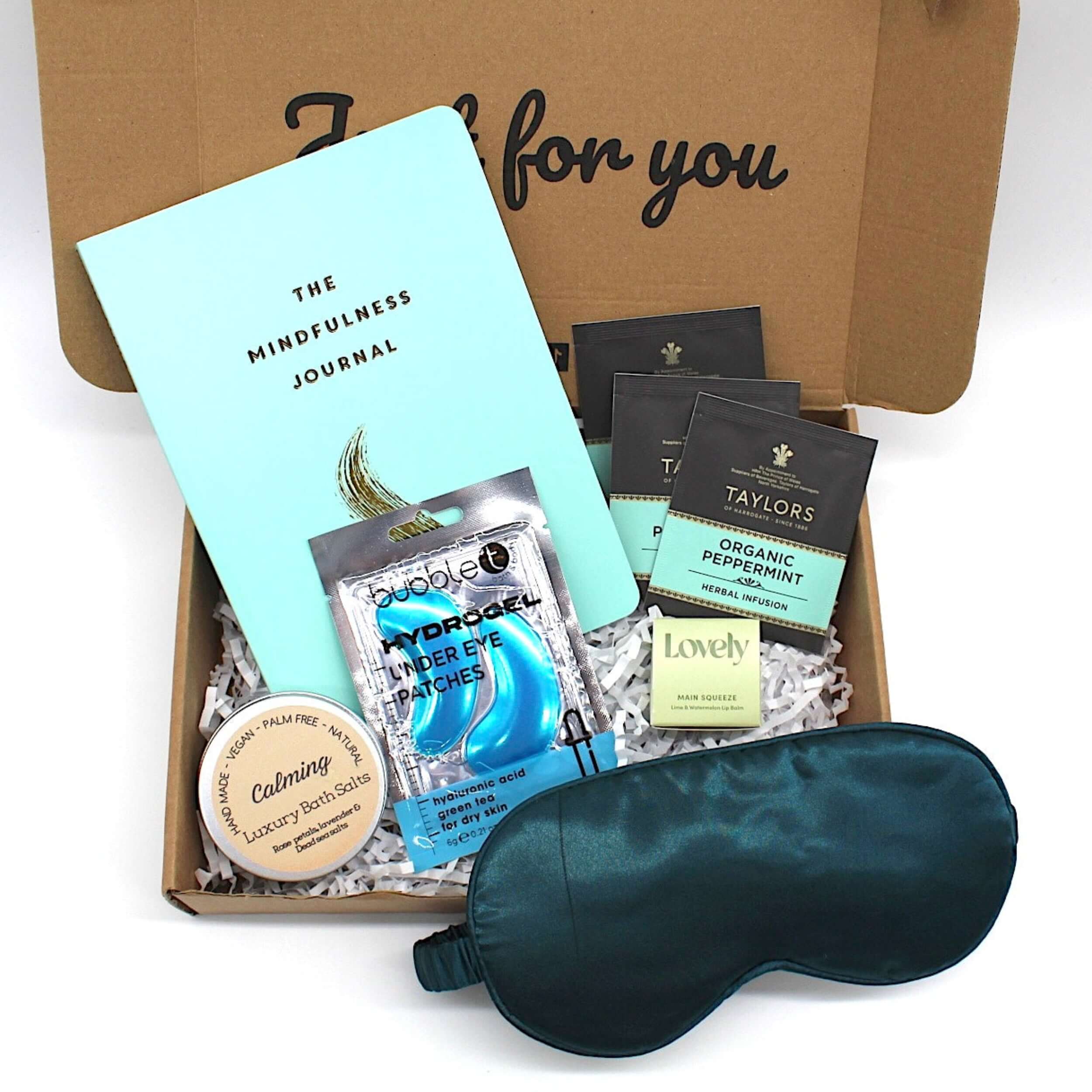 Positive mindfulness set with journal and self care products.