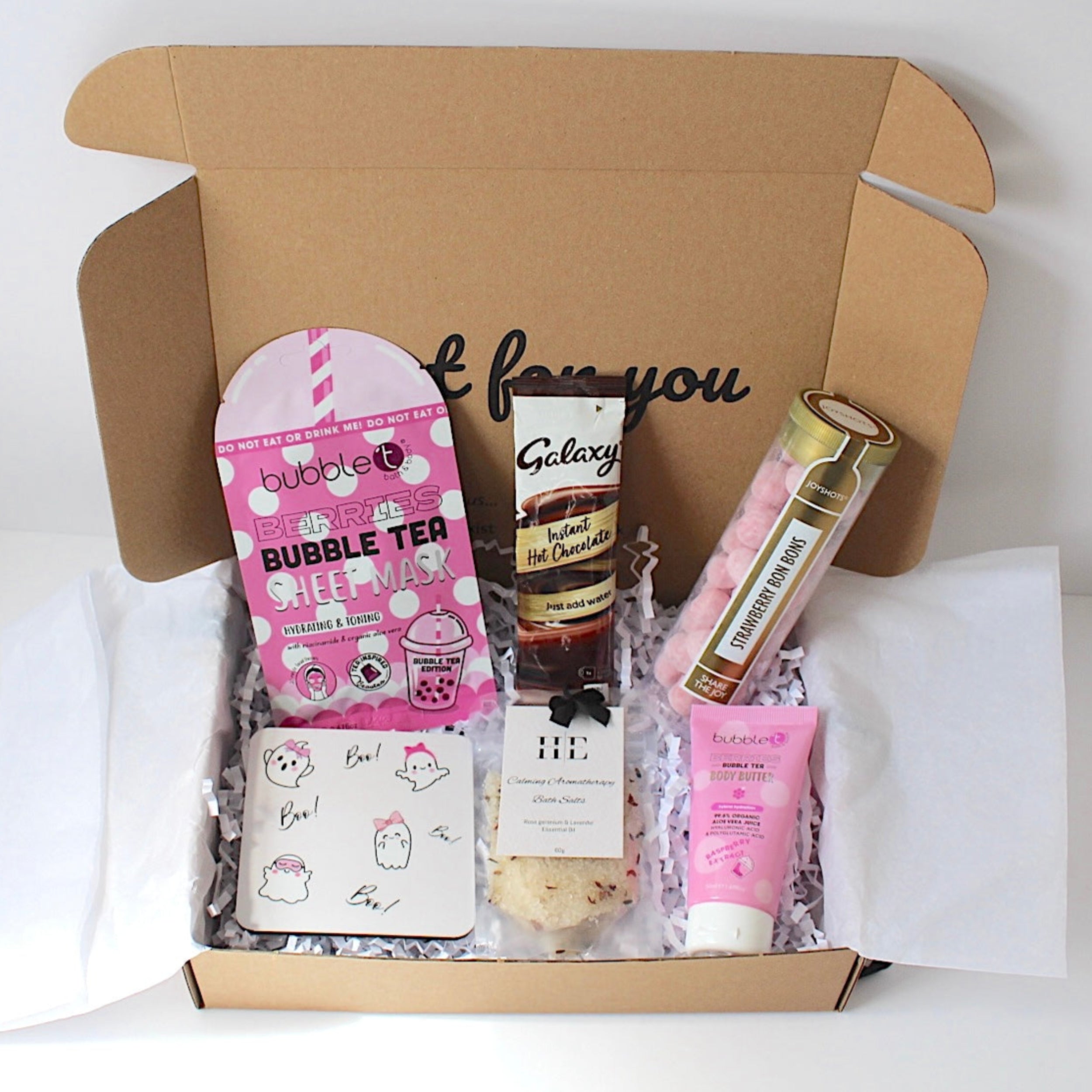Cosy season gifting with cute ghost coaster, hydrating sheet mask, aromatherapy bath salts, strawberry bom boms, hot chocolate sachet and berries body butter