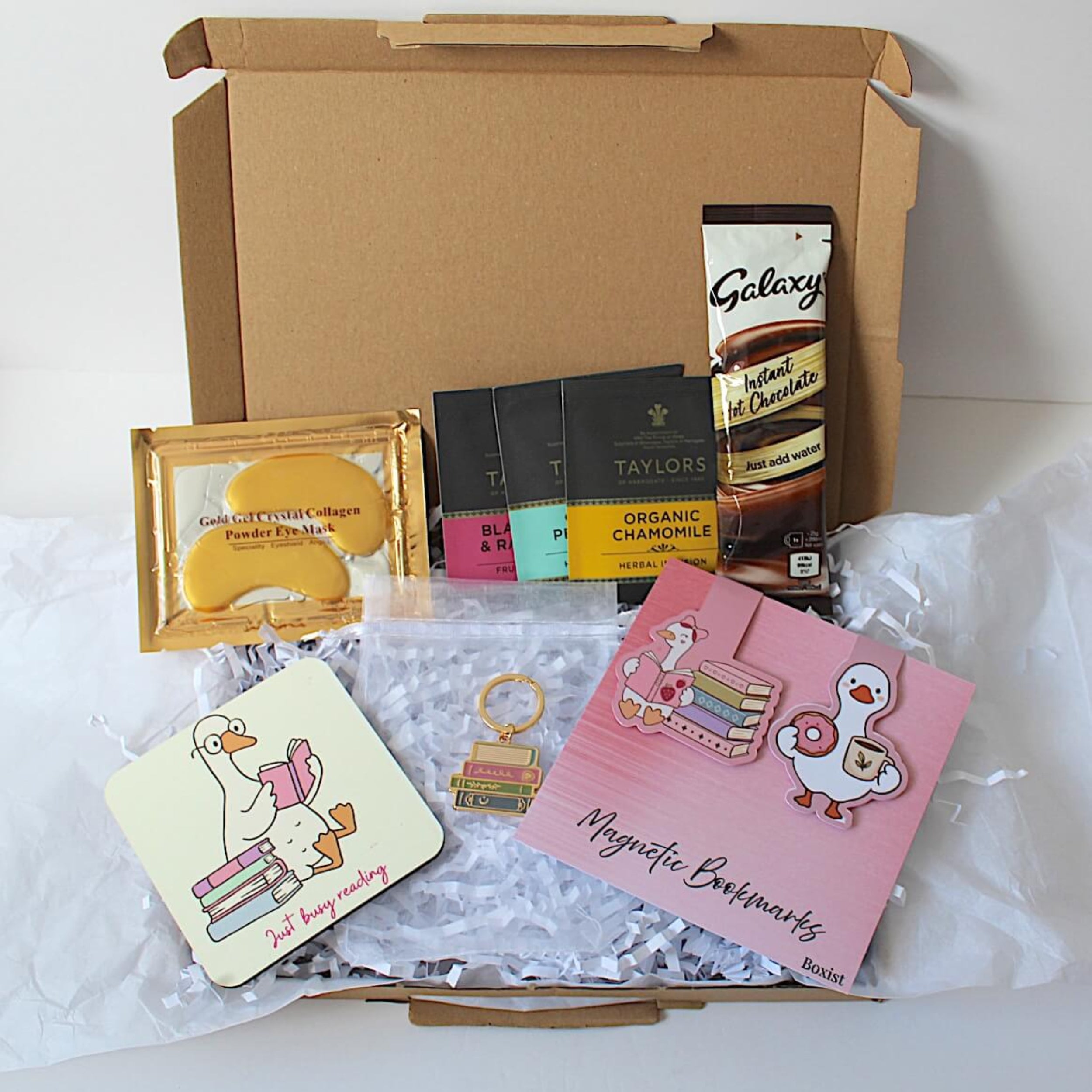 under eye patches, 3 individually wrapped tea bags, galaxy hot chocolate, under eye patches, coaster, book lover keyring, magnetic bookmarks. Presented in letterbox friendly gift box 