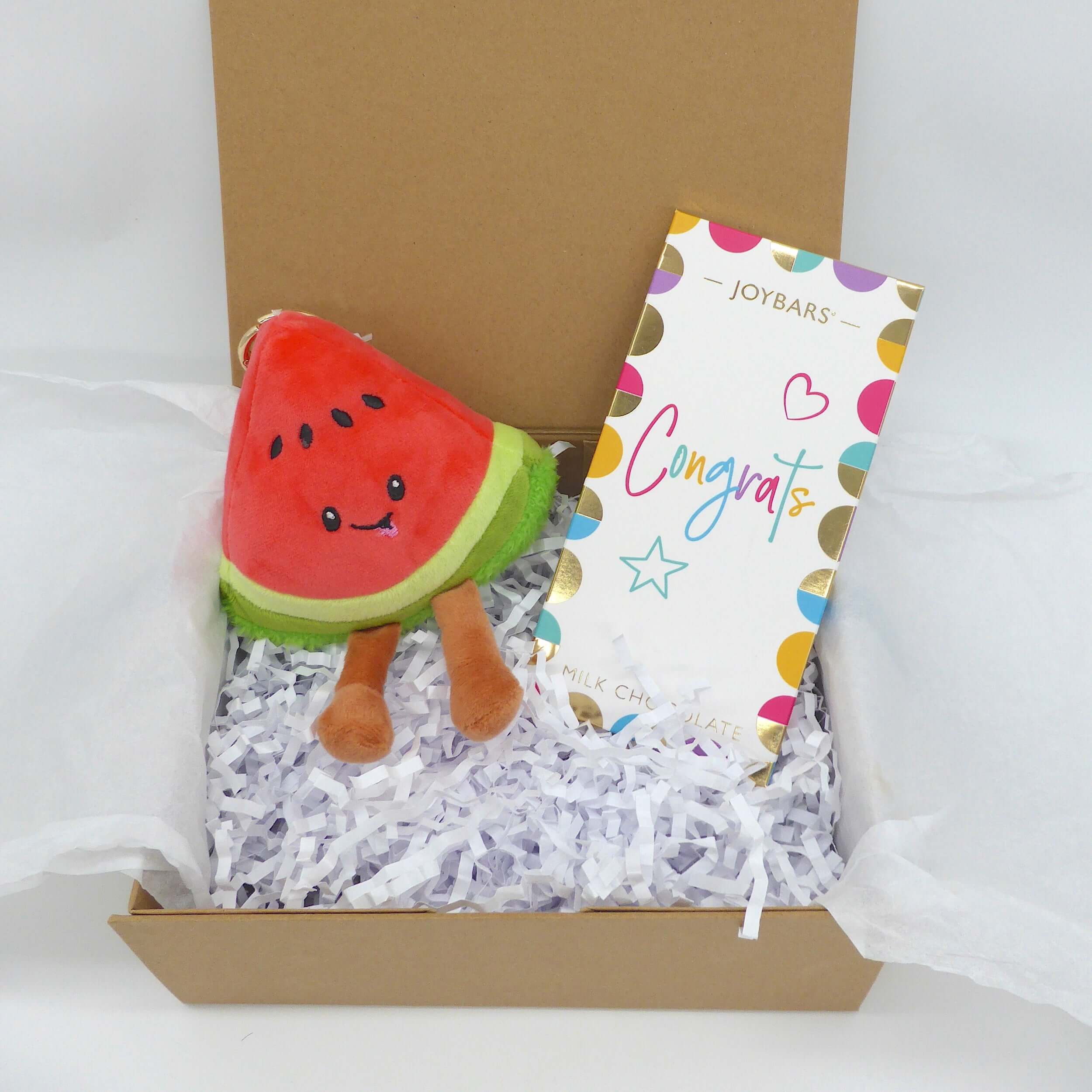 Congrats Plush gift set featuring watermelon plush, congratulations card, and Colombian chocolate in gift box.