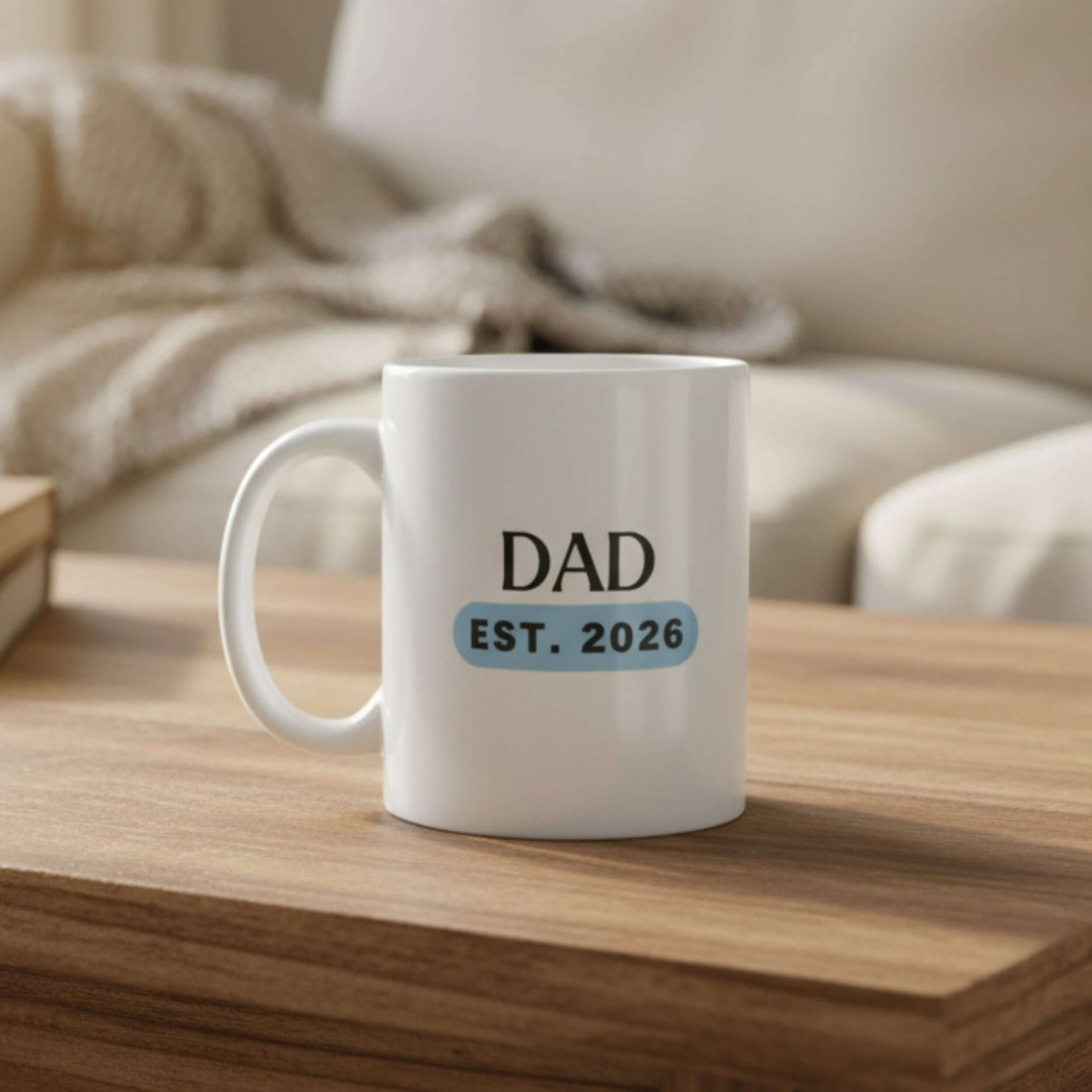 Dad EST. 2026 ceramic mug resting on a wooden table, perfect gift for new fathers.