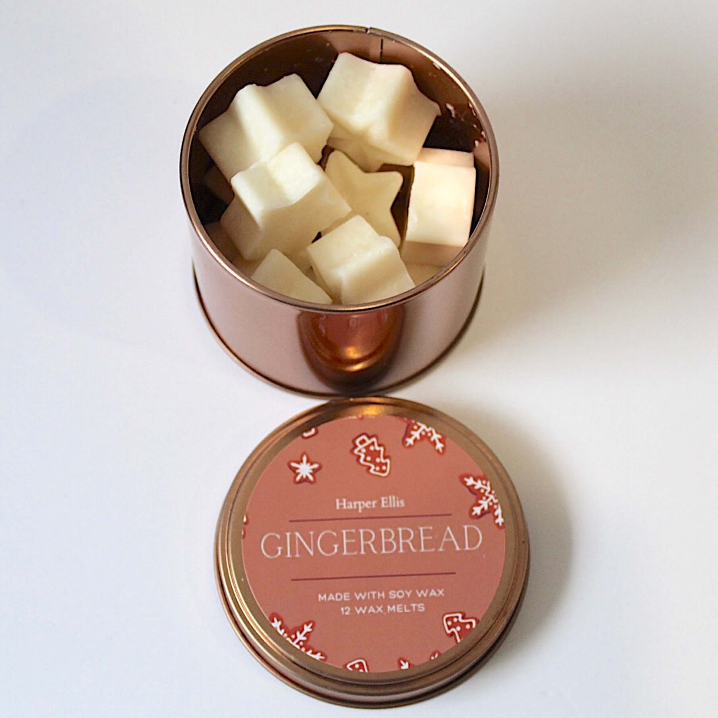 Gingerbread  soy wax melts in a decorative tin with a pink lid on a white background