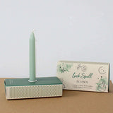 Good luck wish candles, light green candle mounted in the stand 
