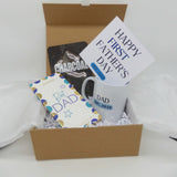 Father's Day gift for new dad in a gift box with mug, card, chocolate, and charcoal mask.