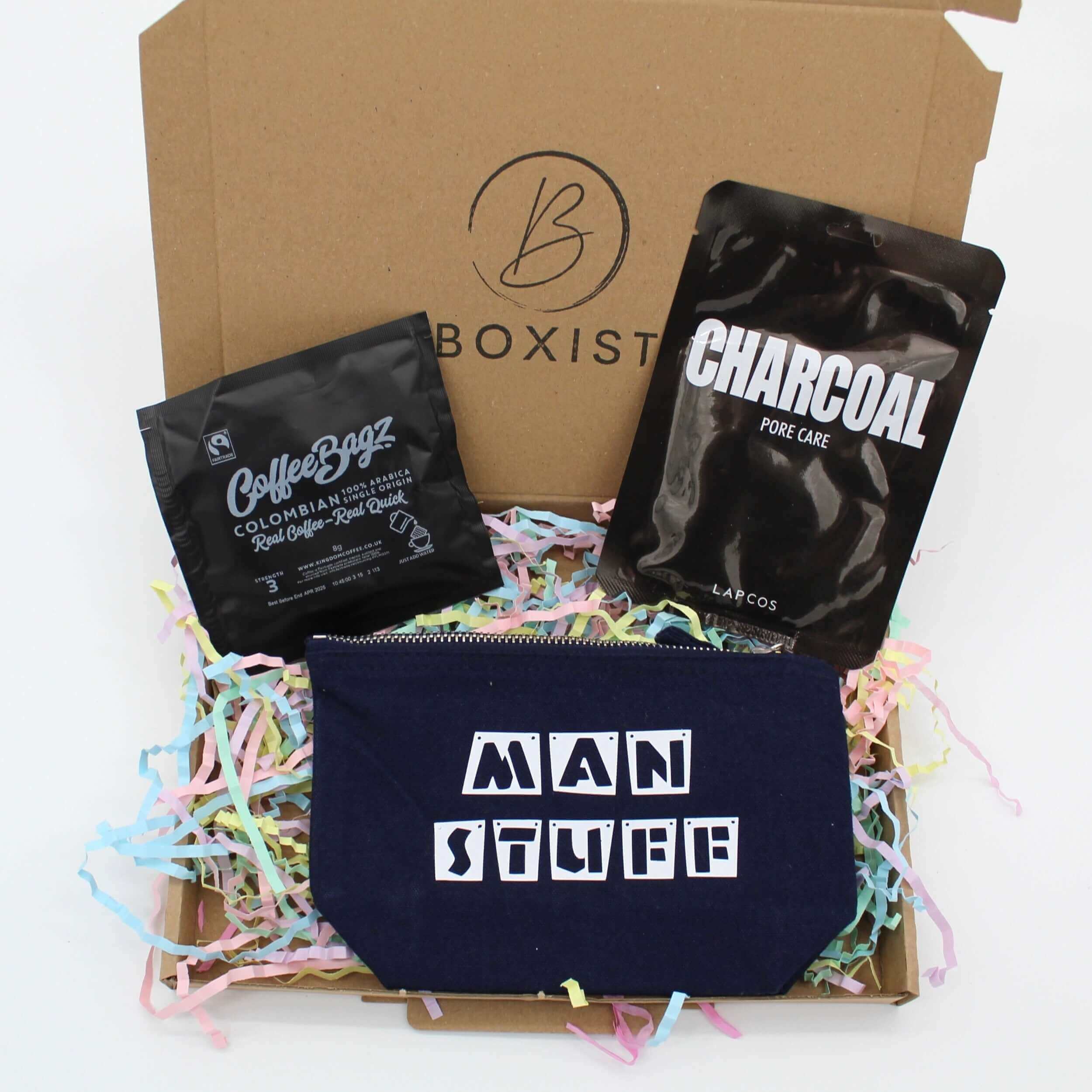 Treat him to this mini letterbox gift. Includes a wash bag, charcoal sheet mask and a coffee bag. 
