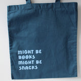 Blue tote back with light blue writing might be books, might be snacks"