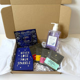 Never lose your sparkle gift set, 3 individually wrapped tea bags, never lose your sparkle book, sensory retreat heated eye mask, Sunday Rain lavender  ody wash.