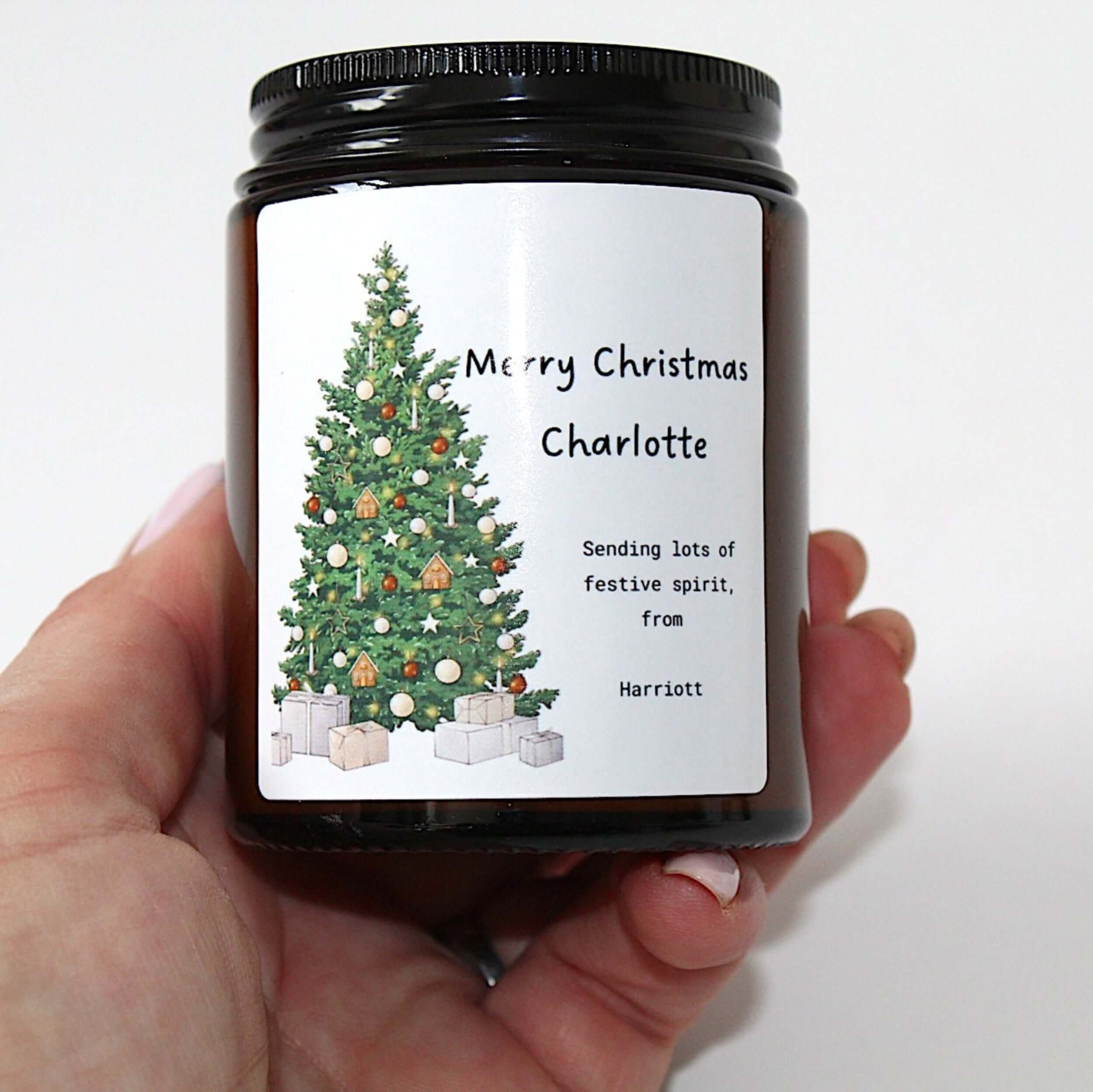 Personalised Christmas candle in an apothecary jar with a festive design and custom label.