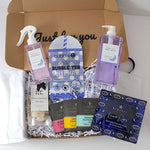 Box of skincare and wellness products including a bubble tea sheet mask, eye masks, and other items.