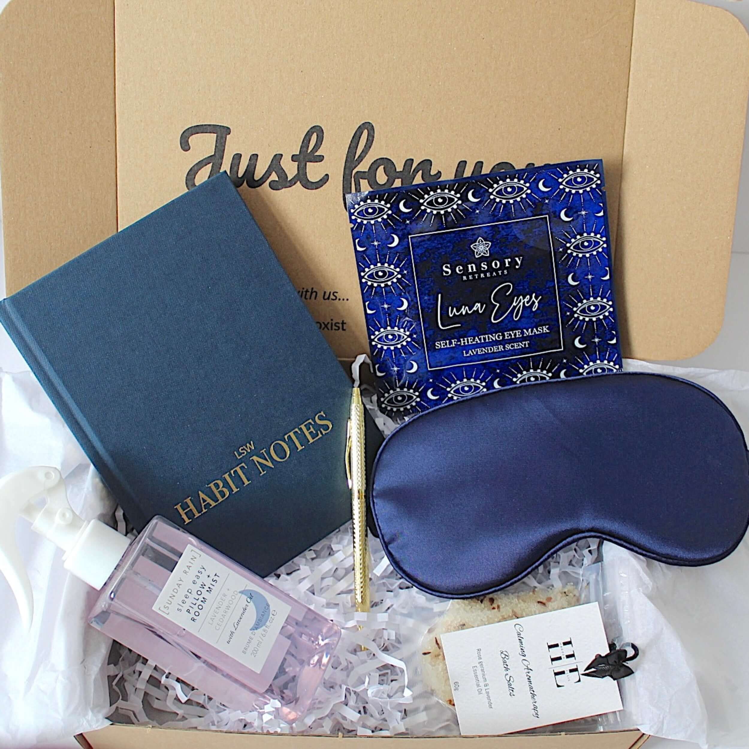 Sleep-themed gift set with eye mask, LSW Habit notes journal, and other items in a box.
