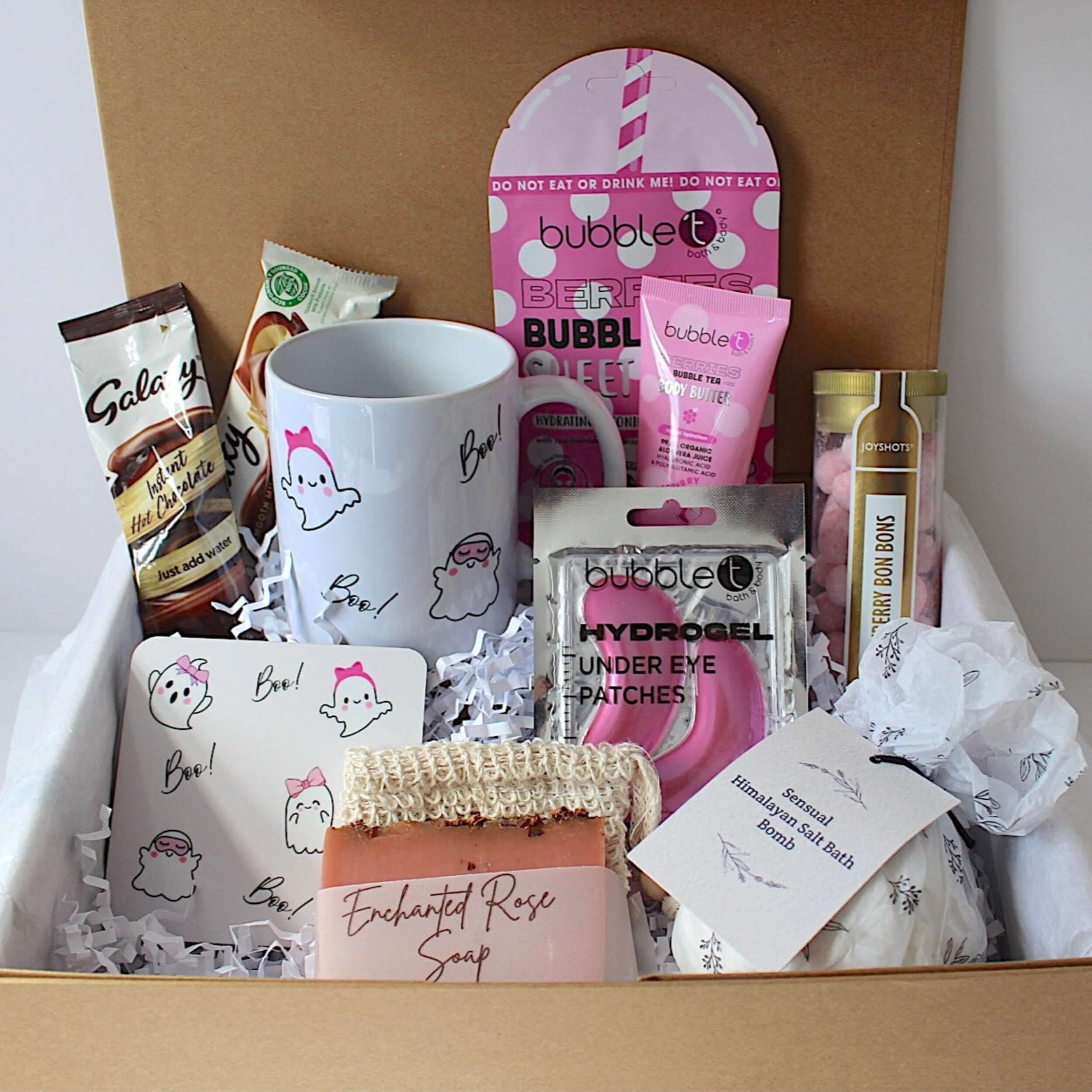 Gifting box with various items including a mug, soap, and skincare products.