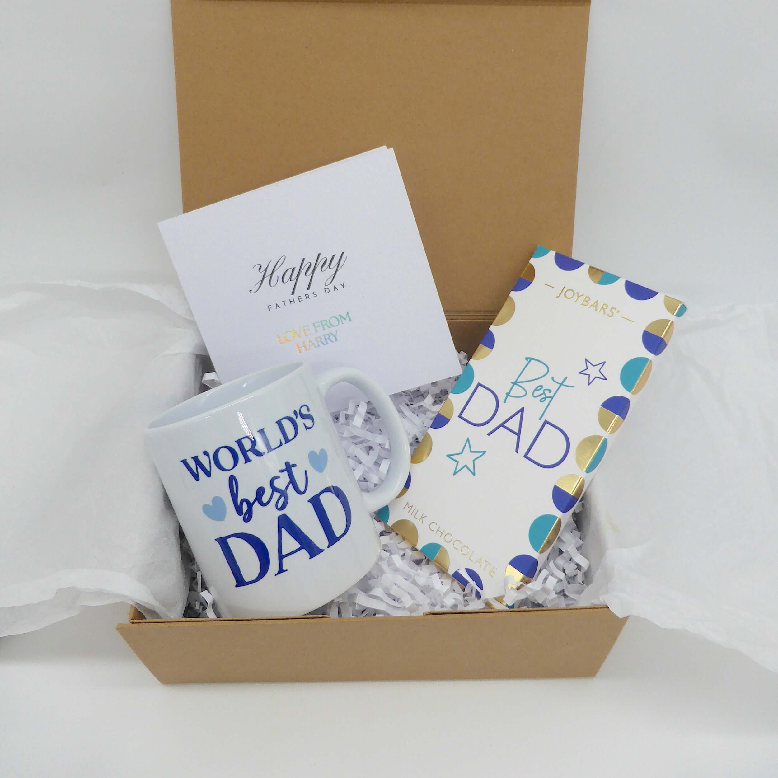 Best Dad Gift Set featuring coffee mug, chocolate bar, and greeting card in a gift box.