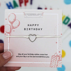 Happy Birthday Bracelet displayed with a card featuring heart design and balloons, perfect for celebration.