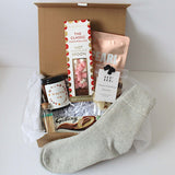 Cosy era luxury gift, cashmere socks, candle and self care treats 