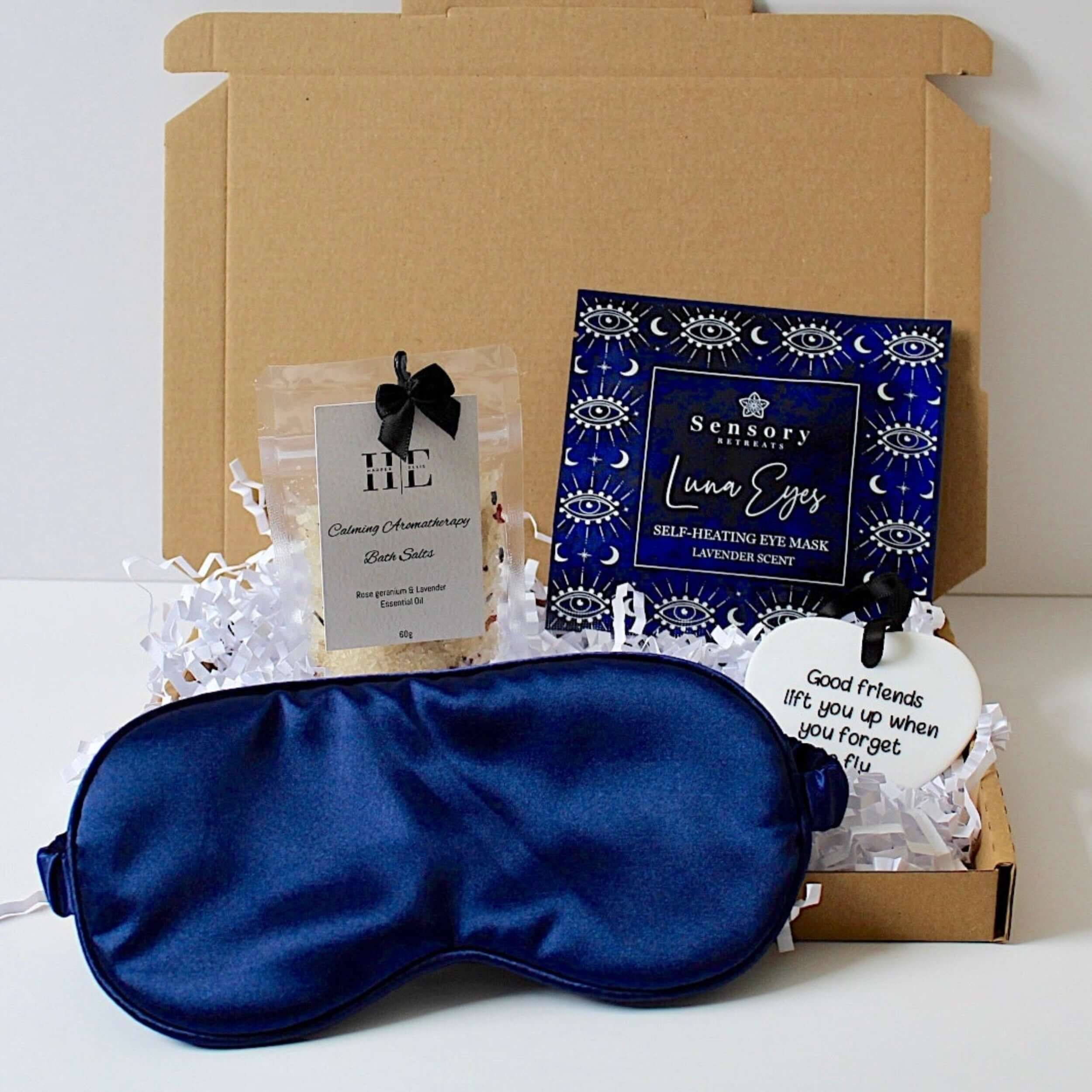 Blue satin eye mask, sensory heated eye mask, Harper Ellis calming. aromatherapy bath salts, and ceramic keepsake for friends. Letterbox friendly.  
