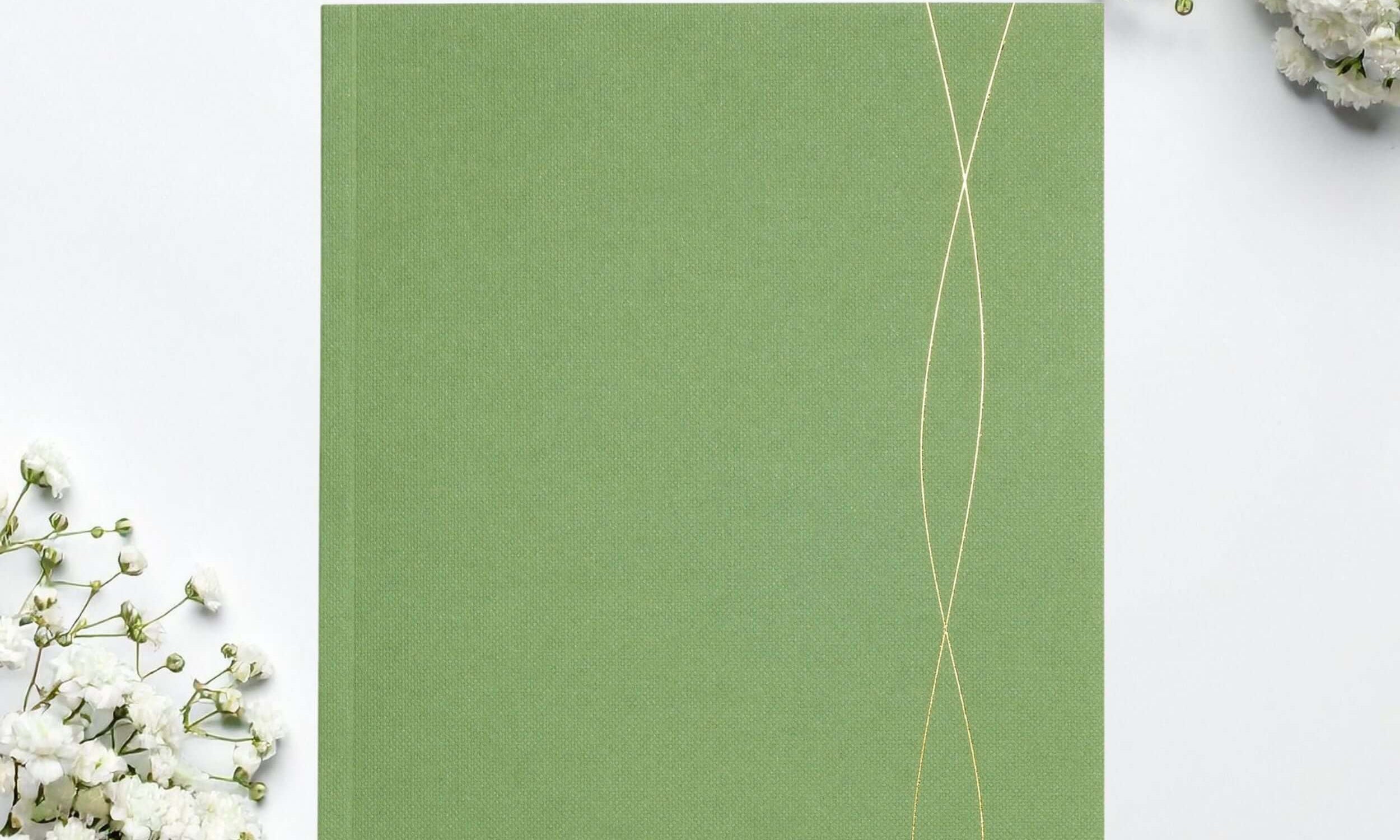 A5 green lined notebook, perfect for jotting down ideas and notes.