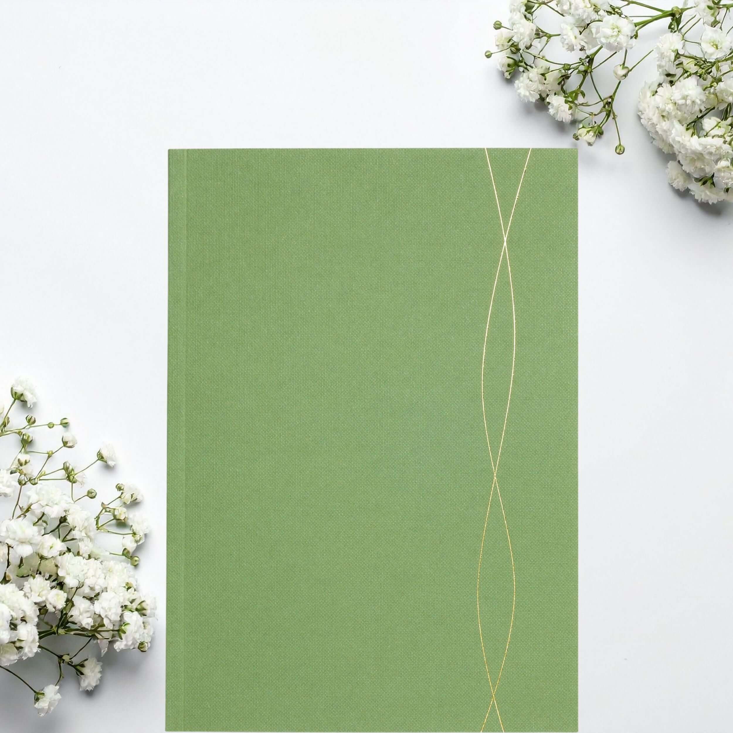 A5 green lined notebook, perfect for jotting down ideas and notes.