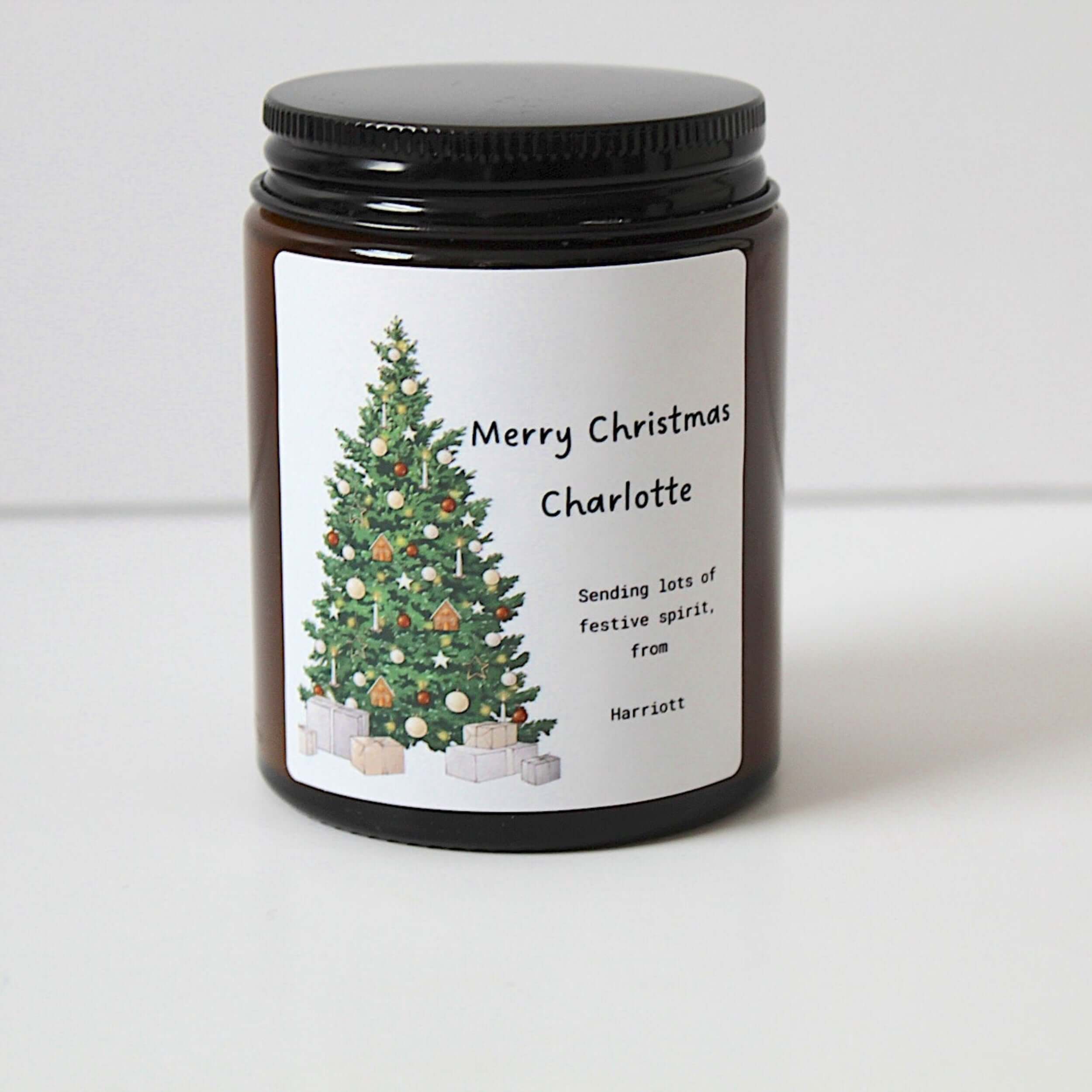 Personalised Christmas candle in an apothecary jar with festive Christmas tree design.
