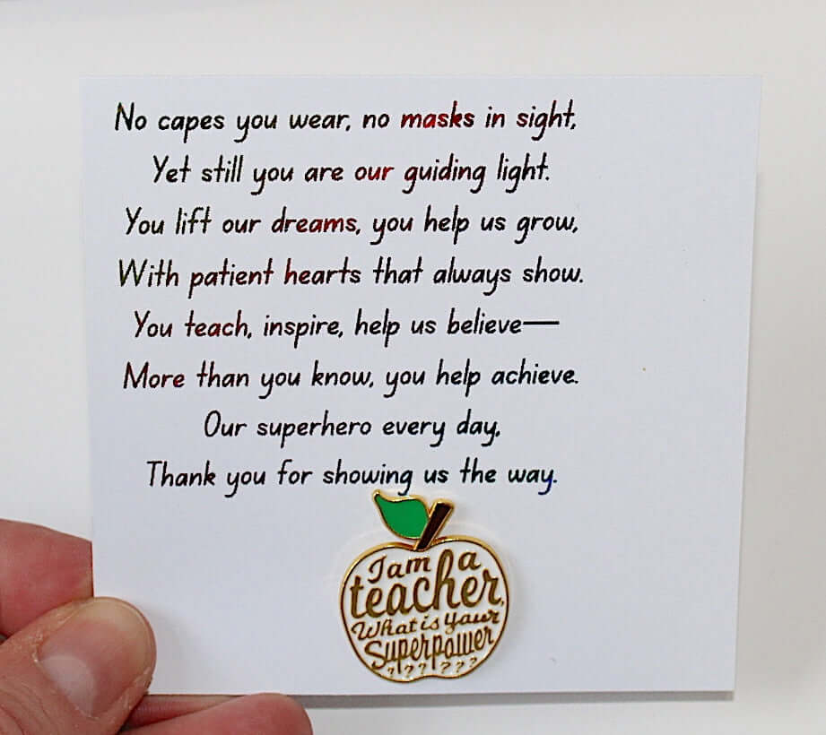 Teacher pin badge featuring an apple design on a card with an inspiring poem about educators.